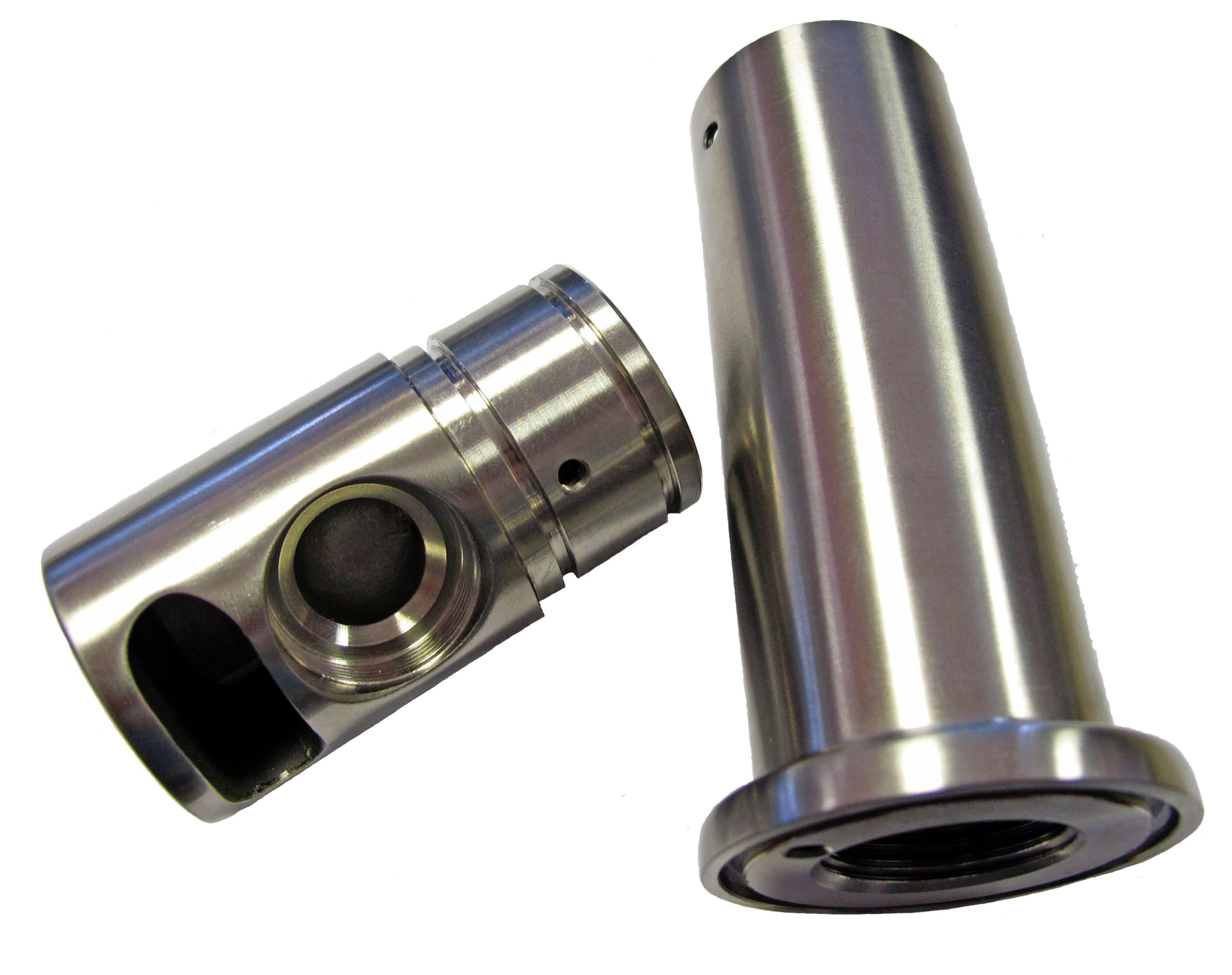 Two polished precision machined cylindrical components